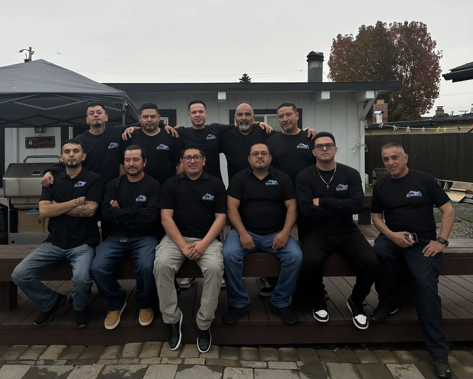 Integrity Home Construction's team of 11 people posing as a group